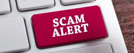 red scam alert button on keyboard